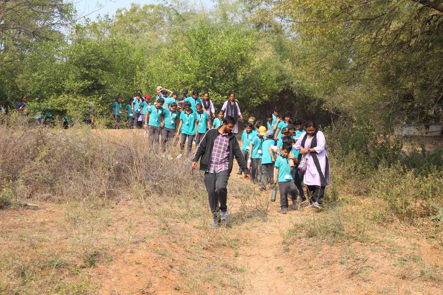 Students walking through a nature park during school field trip