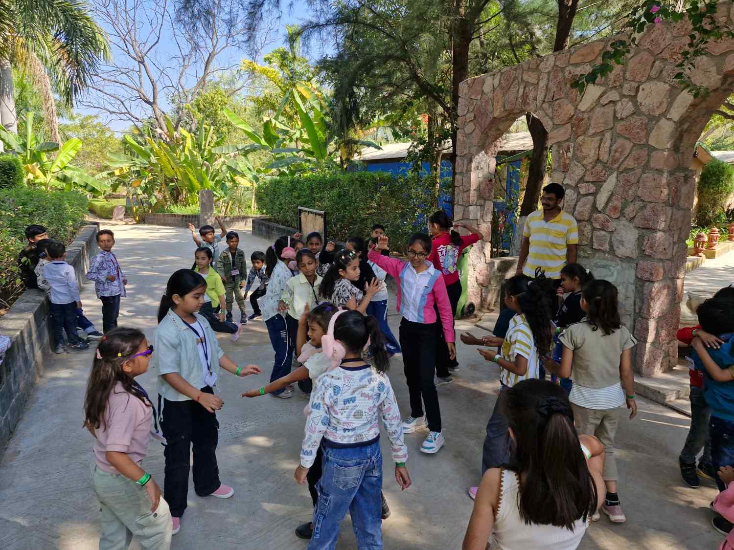 Students dancing and socialising during outdoor school field trip