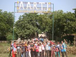 Group photo at the main AARTI Campsite entrance gate