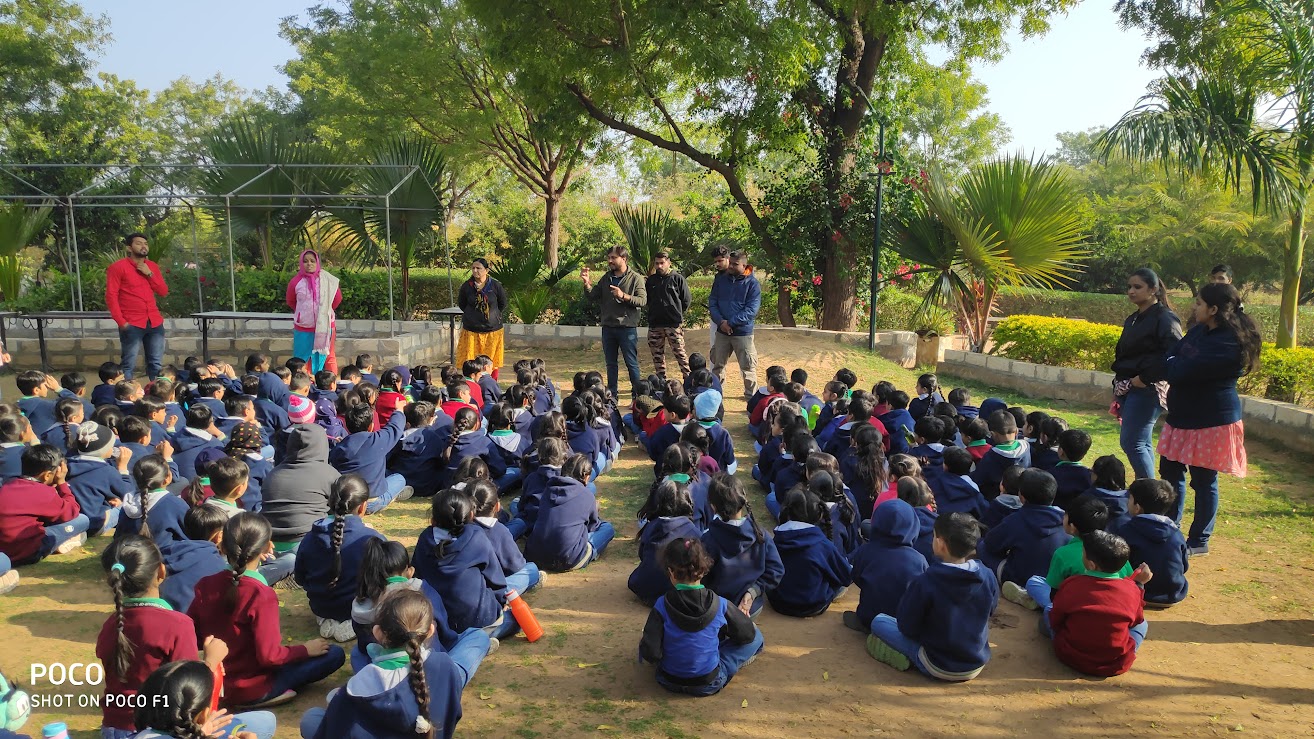 Large group assembly listening to AARTI instructors