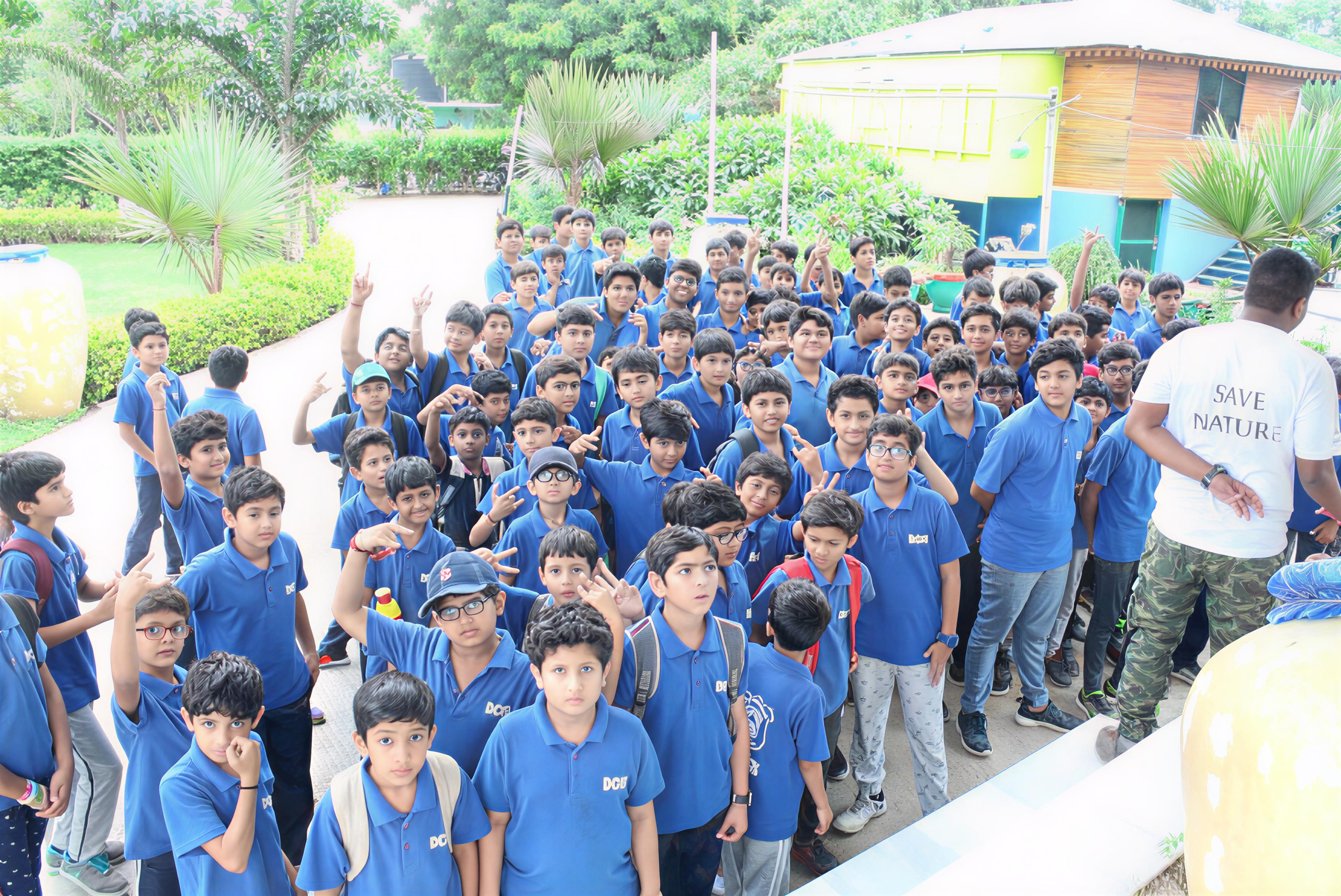 Group photo with instructor wearing Save Nature t-shirt