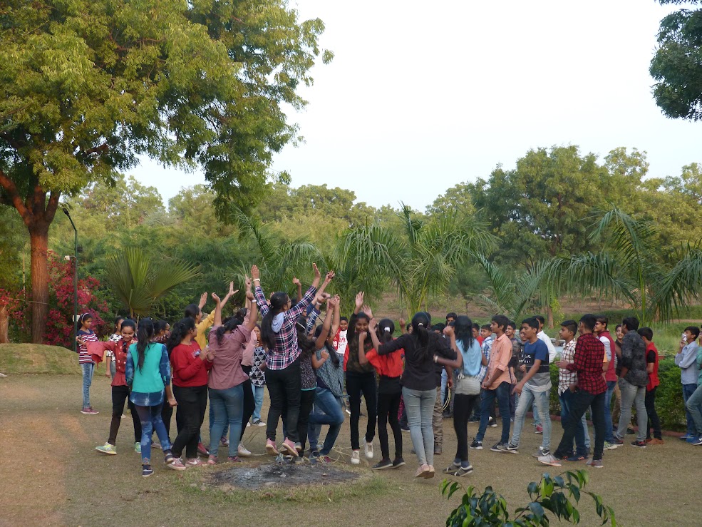 Students jumping and dancing during recreation time