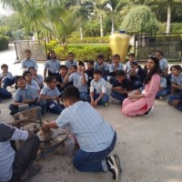 Students watching pottery demonstration