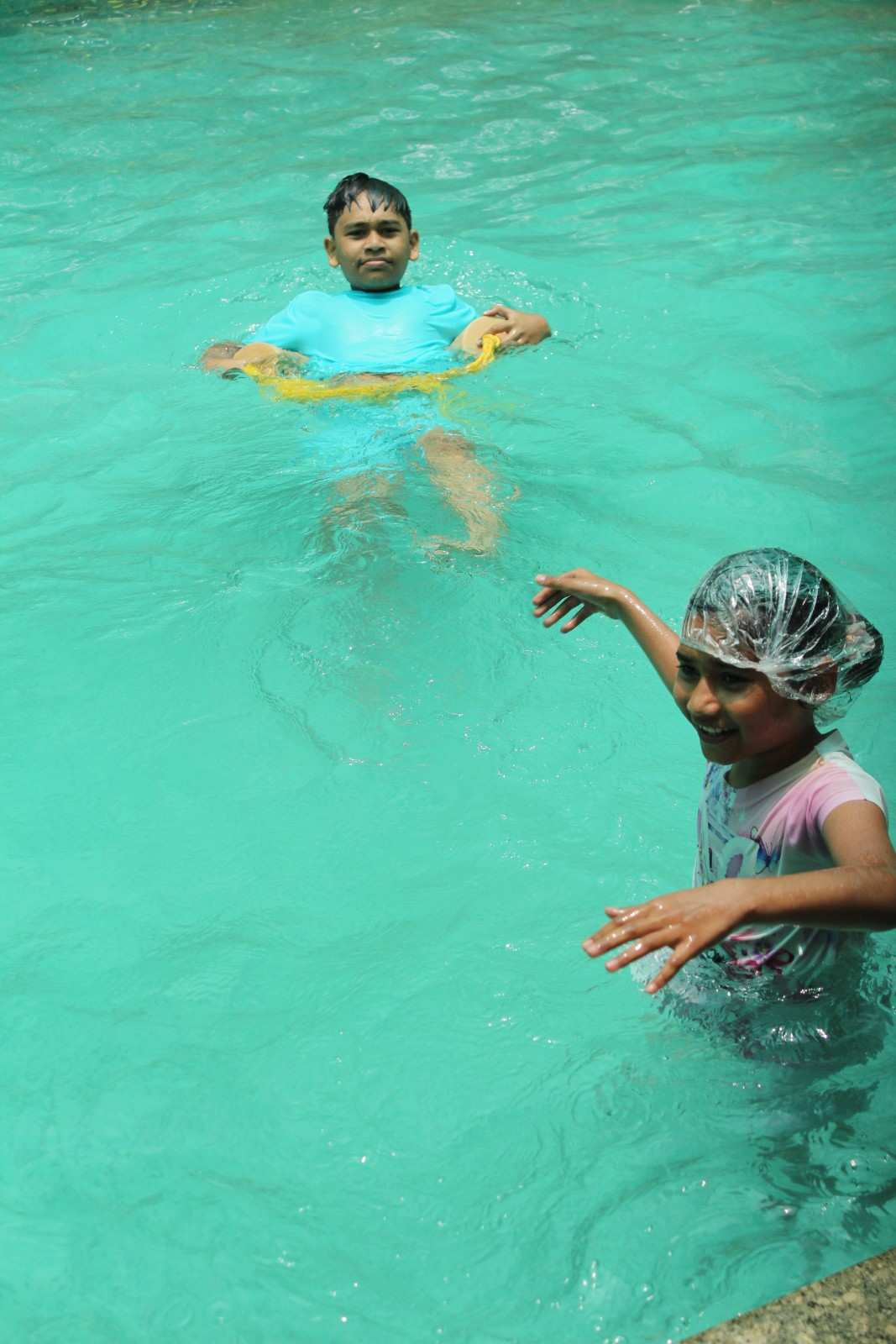 Children having fun in the swimming pool