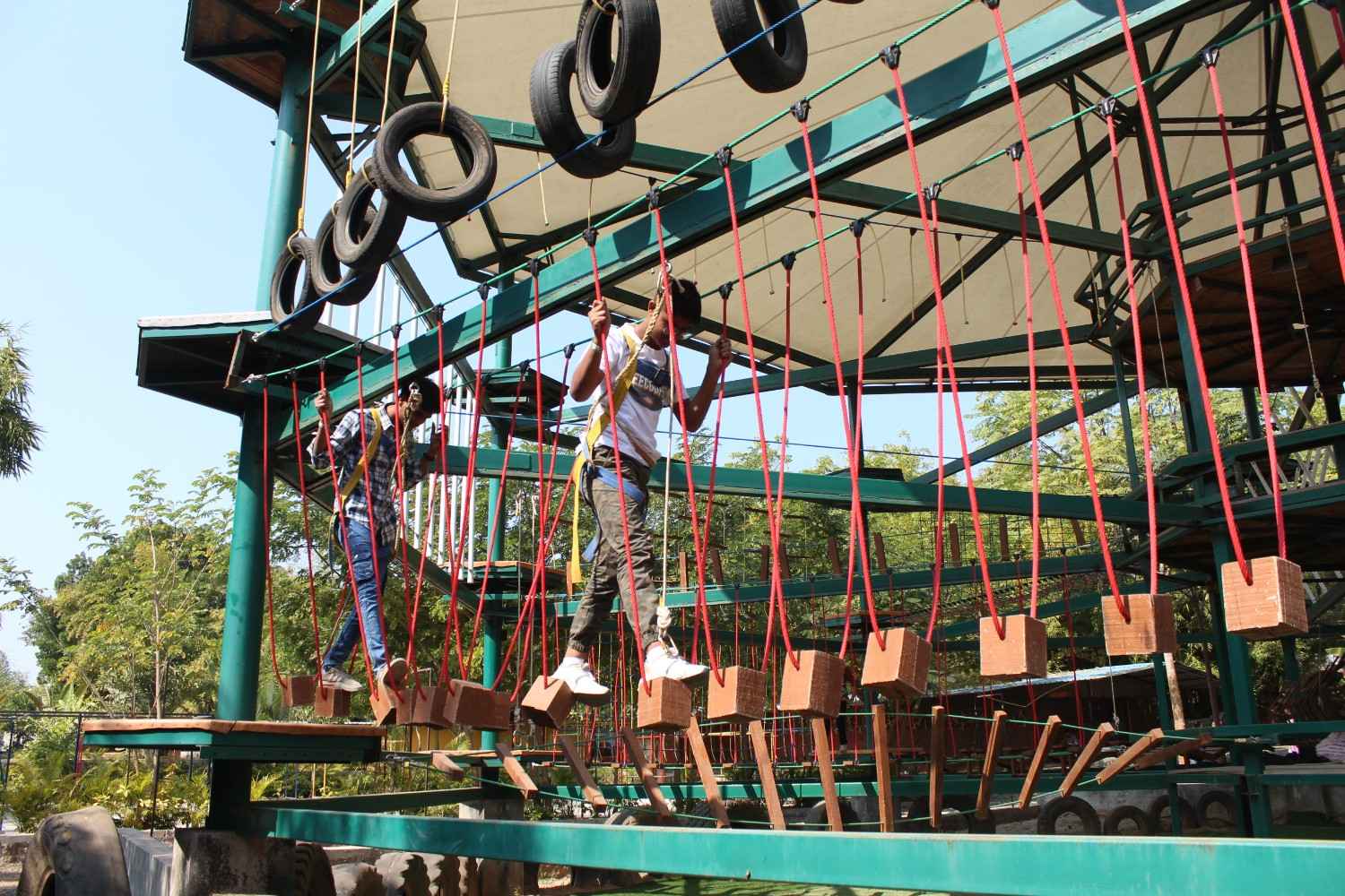 Students participating in a suspended block walk activity
