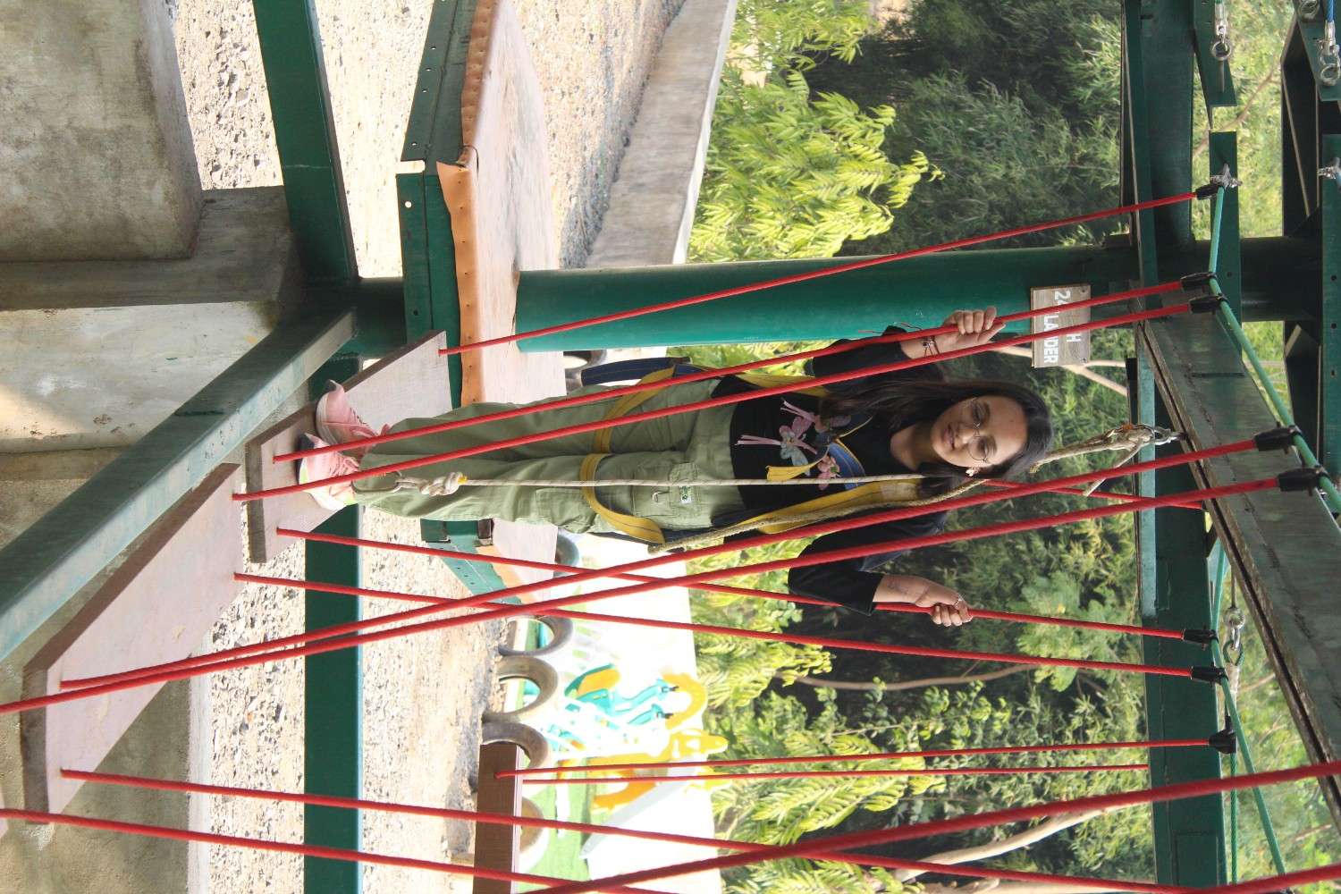 Girl balancing on high ropes