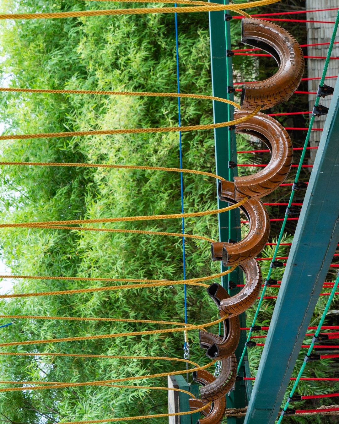Hanging half-tire swing walk obstacle