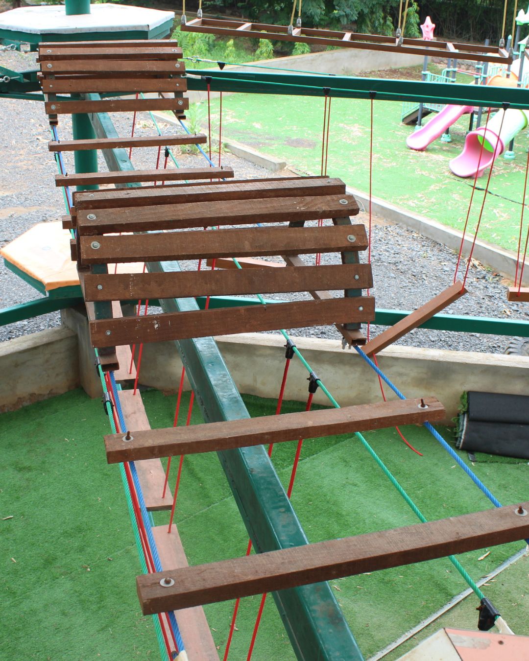 Inclined wooden slat bridge obstacle course element