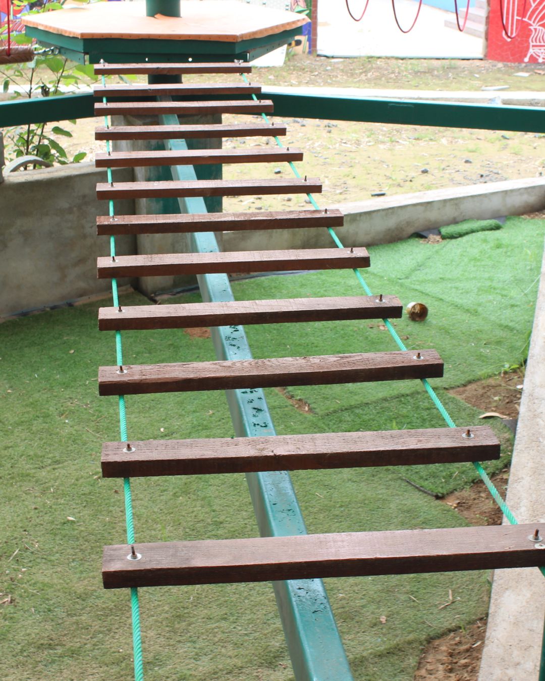 Wooden suspension bridge obstacle on adventure rope course